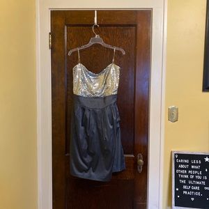 Silver sequin part dress with pockets.
